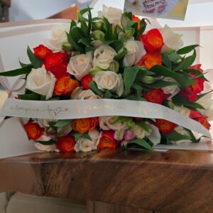 Orange and cream white rose